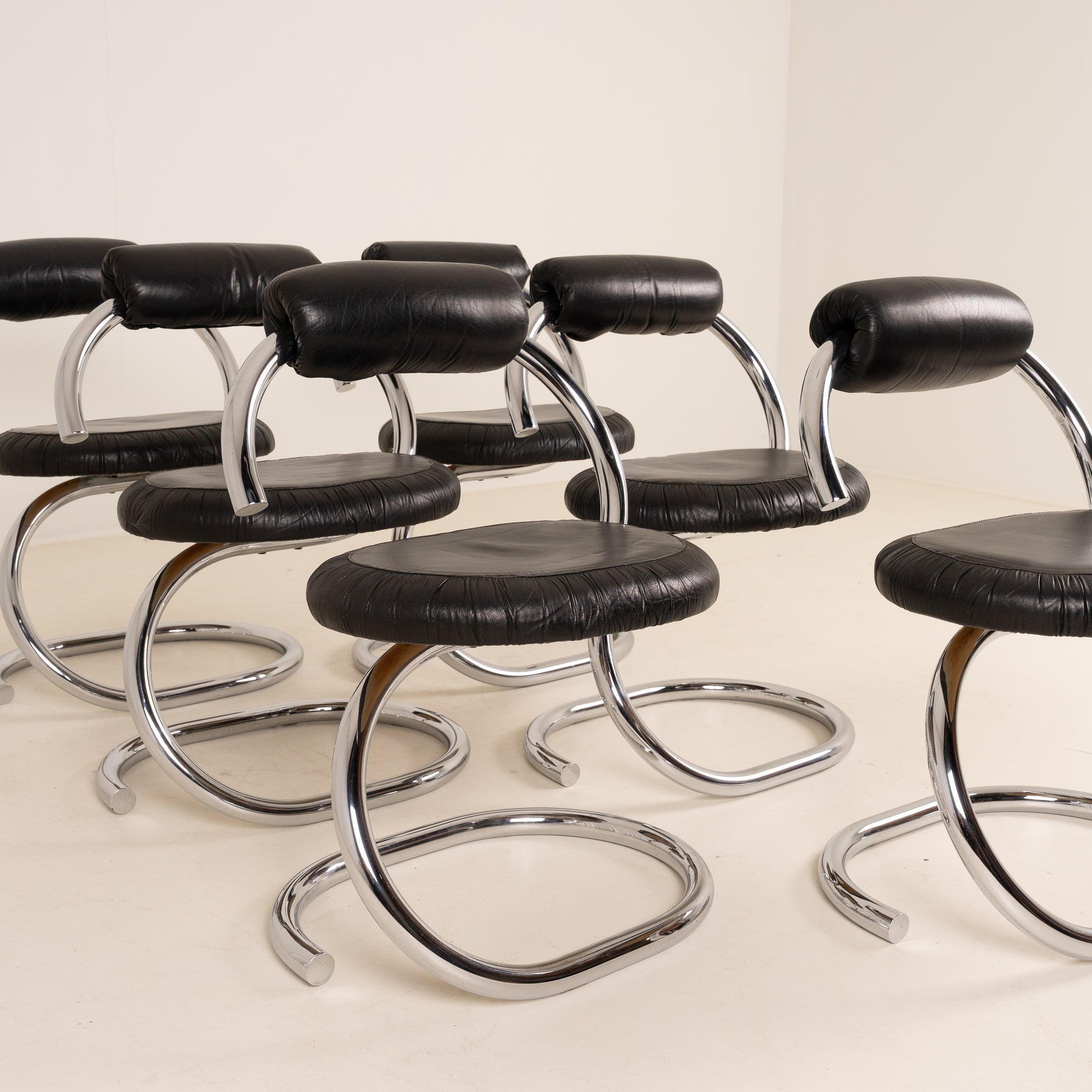 Set of 6 “Cobra” dining chairs by Giotto Stoppino